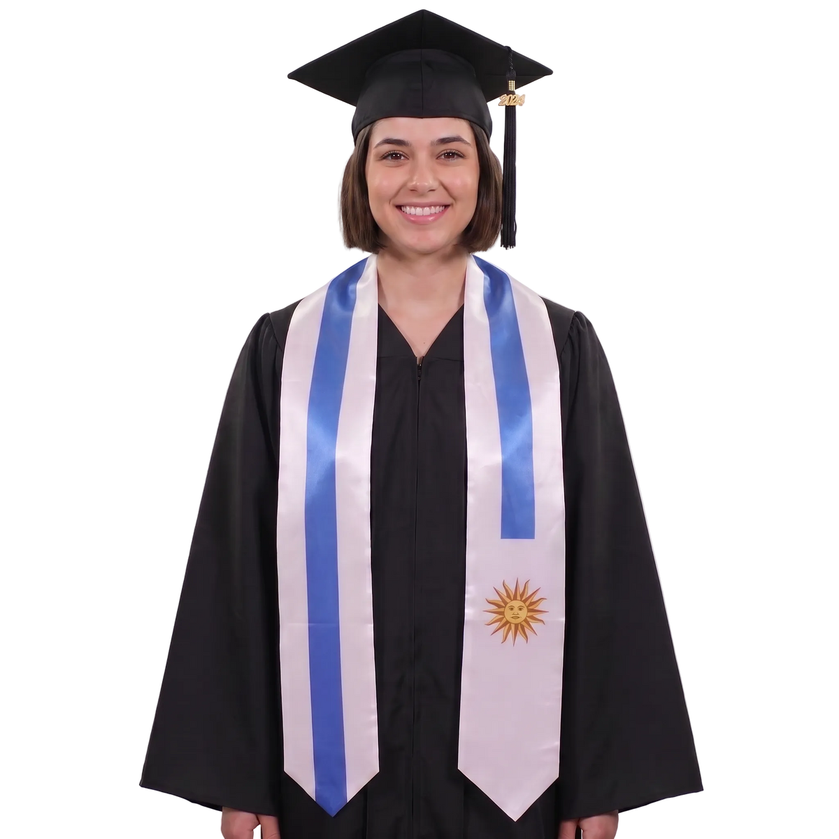 Graduate wearing a Uruguay graduation stole with blue and white stripes and a gold Sun of May, Uruguayan flag sash.
